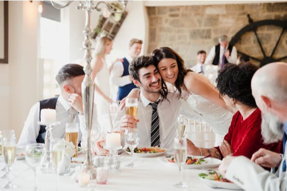 a bride talking with guests at a wedding