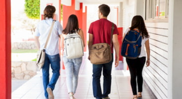 kids prepare to go into school with backpacks