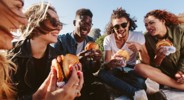 a group of friends enjoy a picnic in the park